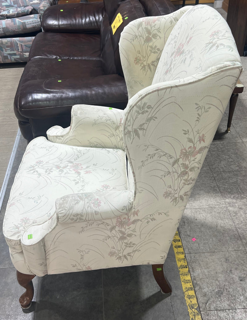 White Wingback Chair with Floral Pattern