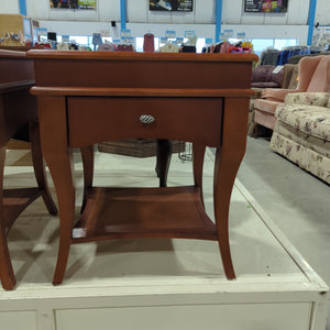 Warm tone side table with one drawer