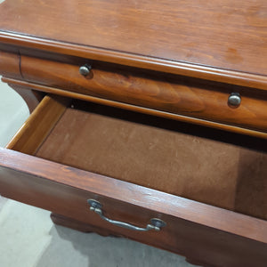 Curved dark nightstand