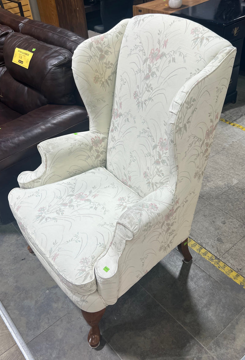 White Wingback Chair with Floral Pattern