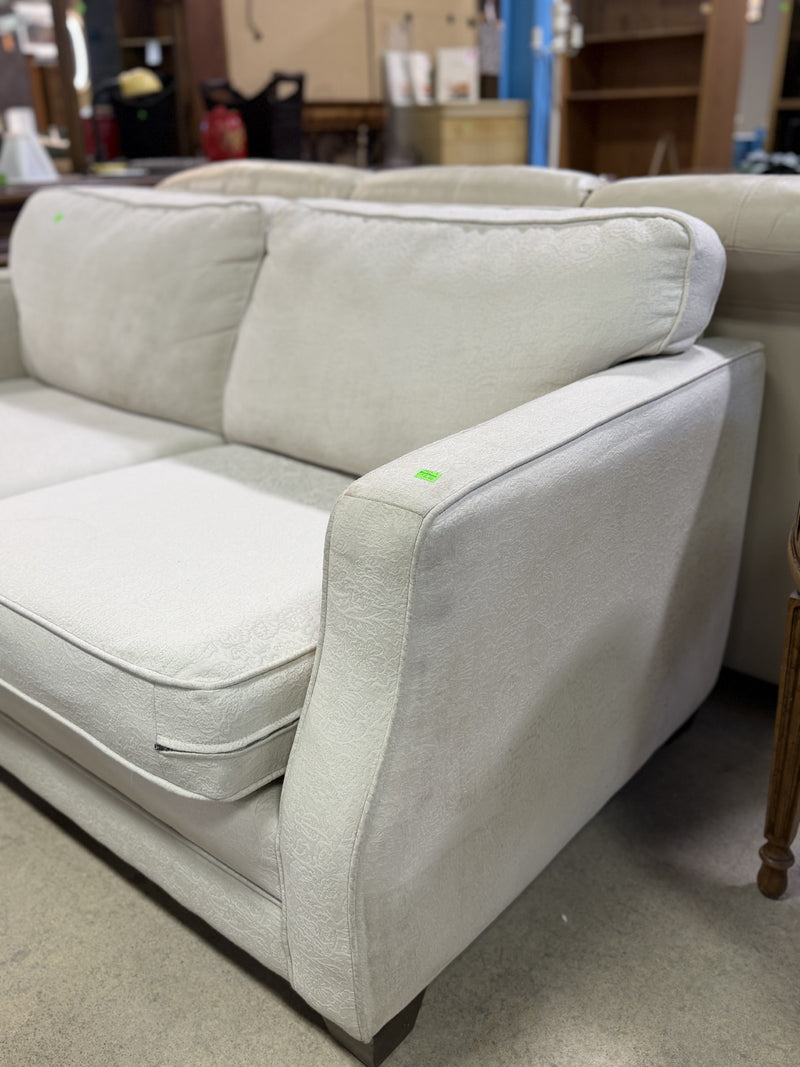 Classic Neutral Two-Seat Sofa – Soft Cream Upholstery