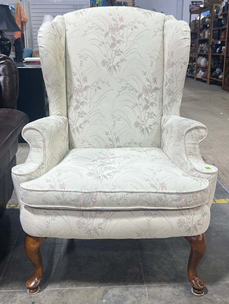 White Wingback Chair with Floral Pattern