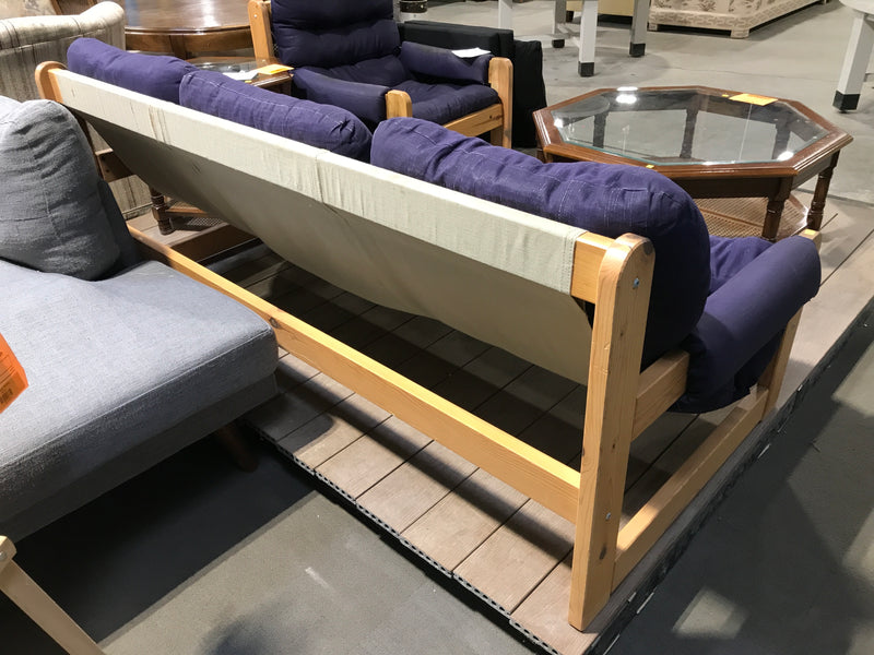Wooden based 3 seater sofa with navy blue cushions