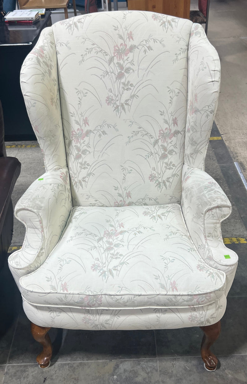 White Wingback Chair with Floral Pattern