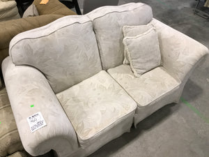 White 2 Seater Couch With Floral Patterns & 2 Throw Pillows