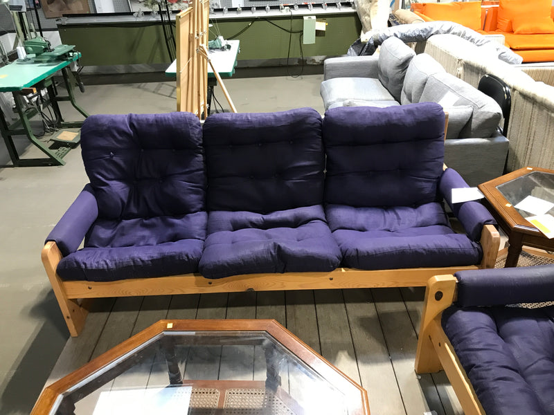 Wooden based 3 seater sofa with navy blue cushions