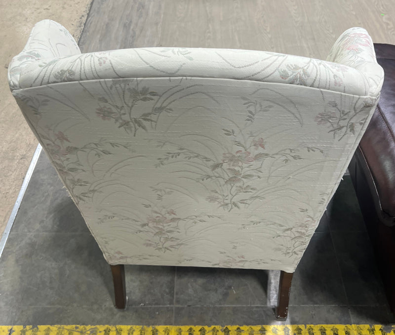 White Wingback Chair with Floral Pattern