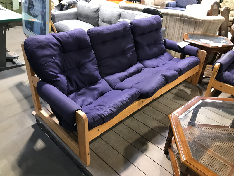 Wooden based 3 seater sofa with navy blue cushions