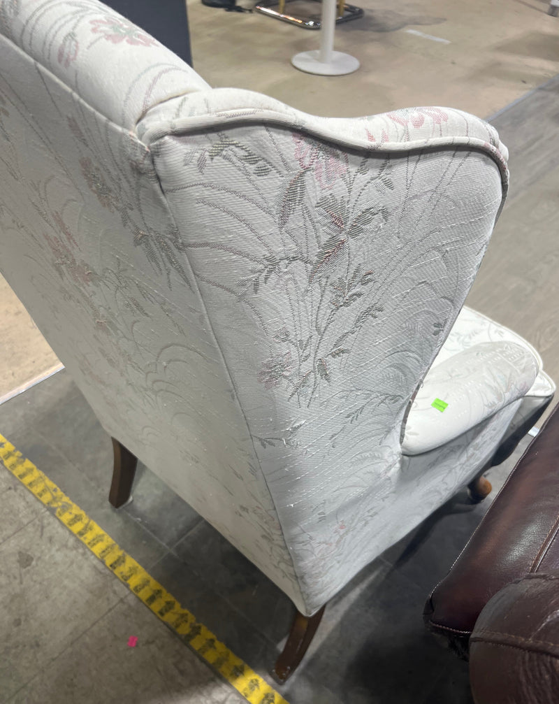 White Wingback Chair with Floral Pattern
