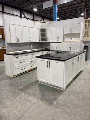 White Shaker Raised Panel Kitchen with Black Hardware and Black Quartz Countertops
