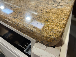 Dark Wood Kitchen with White Island and Caramel Coloured Granite Counters
