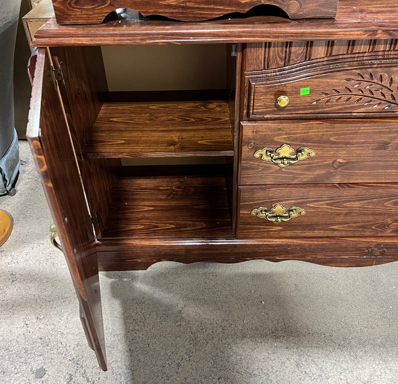 Traditional Dark Wood Dresser with Carved Details