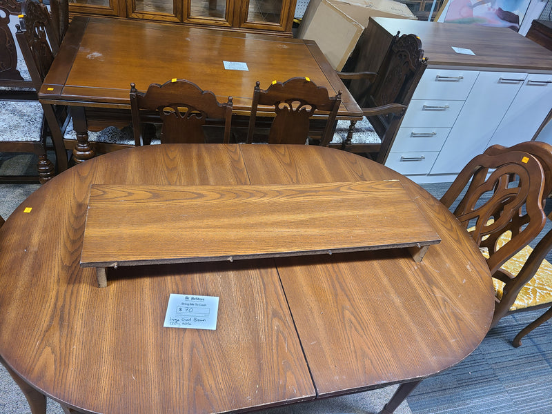 Large Oval Brown Wooden Dining Table with Extension Leaf