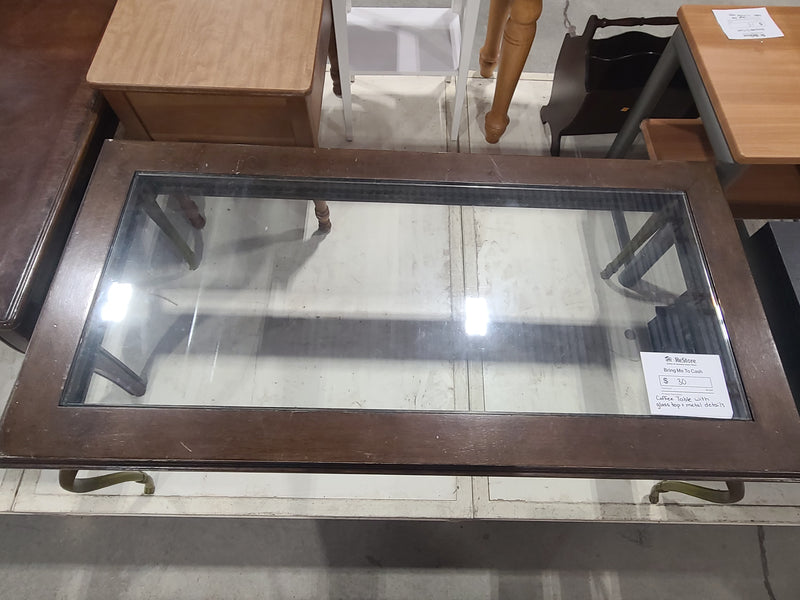 Elegant Coffee Table with Glass Top and Metal Details