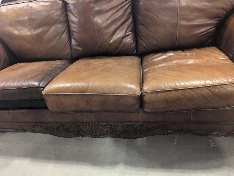 Leather Sofa with Ornate Wooden Framing