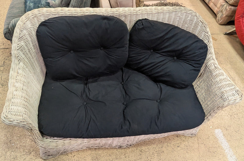 Wicker Loveseat with Black Cushions