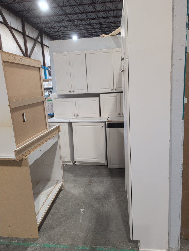 White Melamine Kitchen with Brushed Nickle Hardware and White Laminate Countertops