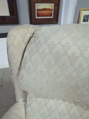 Cream wingback chair