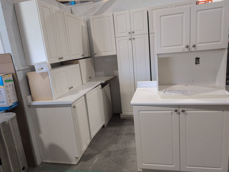 White Melamine Kitchen with Brushed Nickle Hardware and White Laminate Countertops