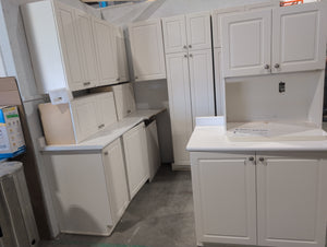 White Melamine Kitchen with Brushed Nickle Hardware and White Laminate Countertops