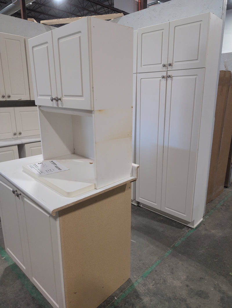 White Melamine Kitchen with Brushed Nickle Hardware and White Laminate Countertops