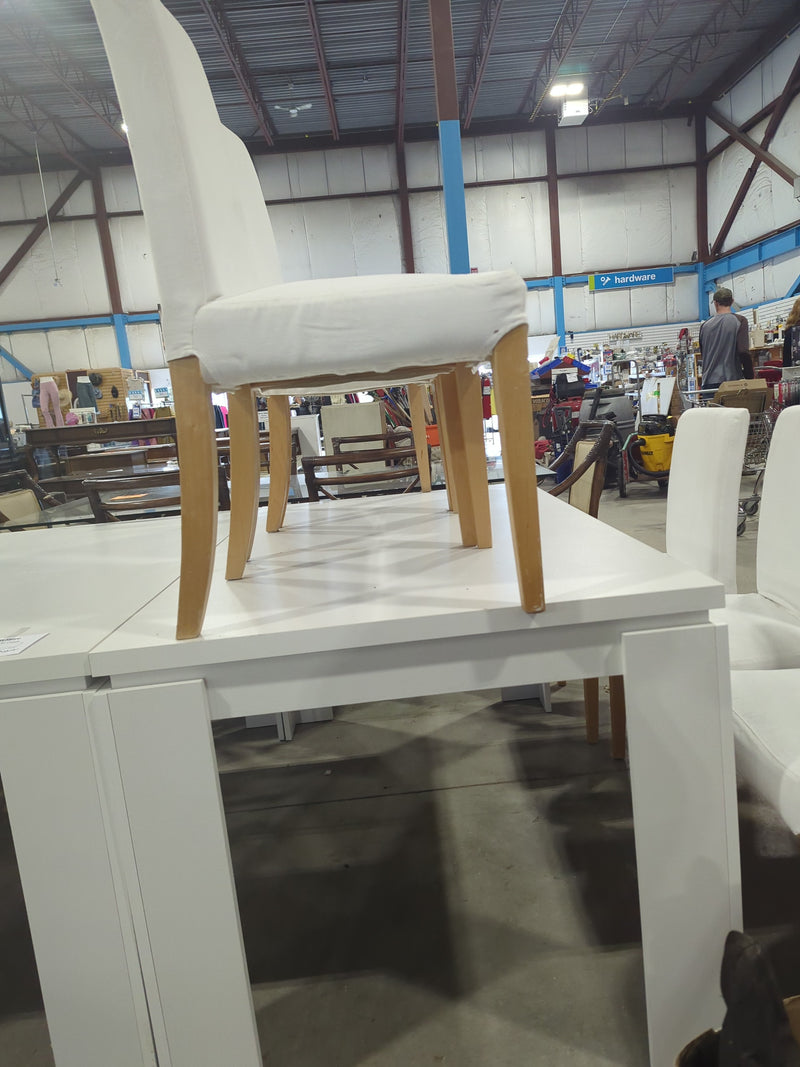 White Rectangular Dining Table with 6 White Chairs