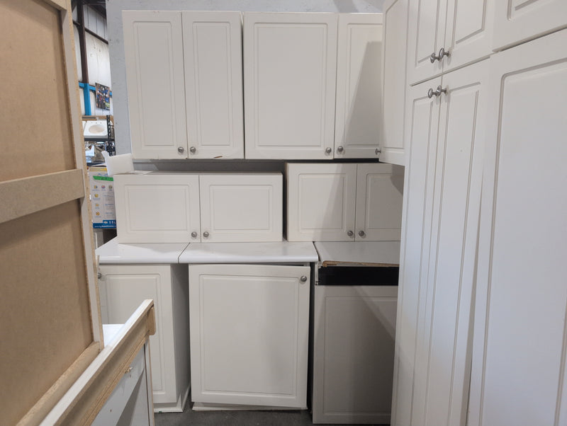 White Melamine Kitchen with Brushed Nickle Hardware and White Laminate Countertops