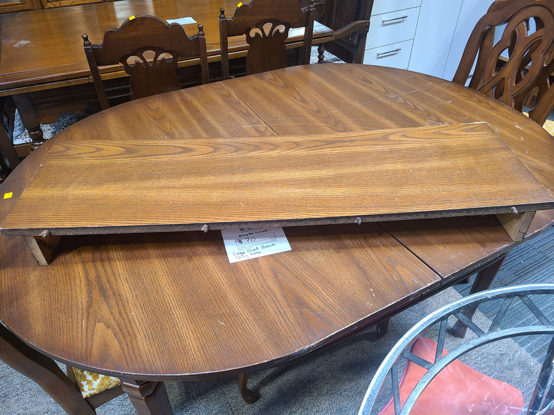 Large Oval Brown Wooden Dining Table with Extension Leaf