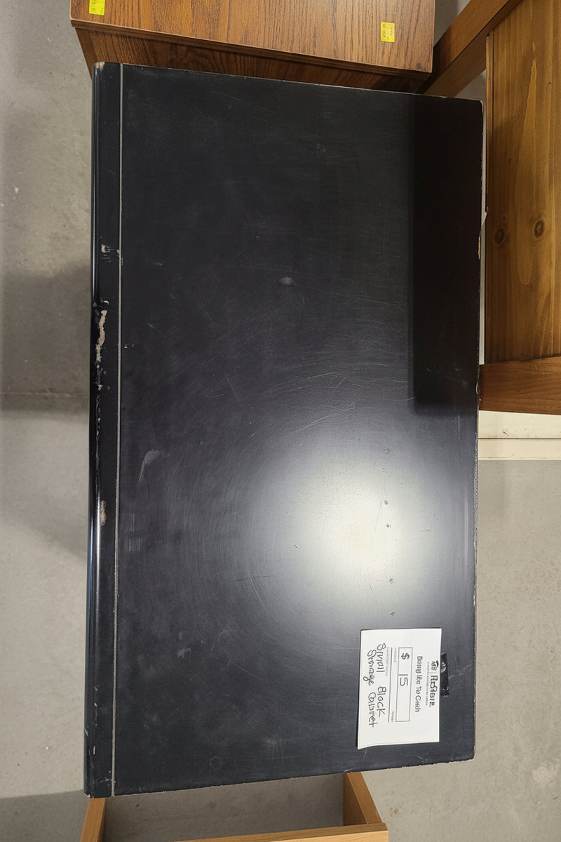 Small Black Two-Door Storage Cabinet with Metallic Trim