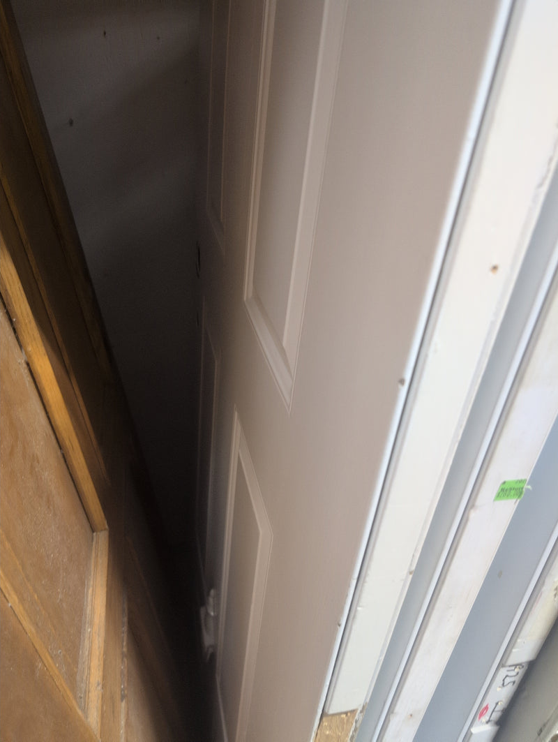 White Exterior Door with Pre-Drilled Holes and a Door Knocker