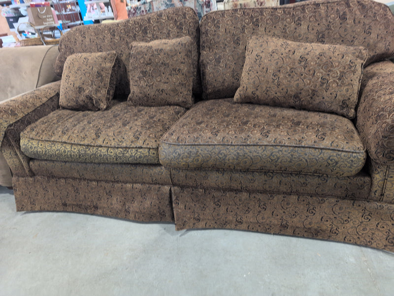 Brown 2 Seater Sofa with Swirly Patterns and Pillows