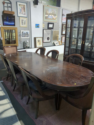 Long Dark Wood Dining Table with Eight Upholstered Chairs