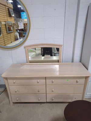 Light-colored wooden 6-drawer dresser with a matching detached mirror