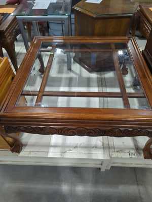 Glass topped coffee table