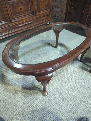 Glassed top oval coffee table