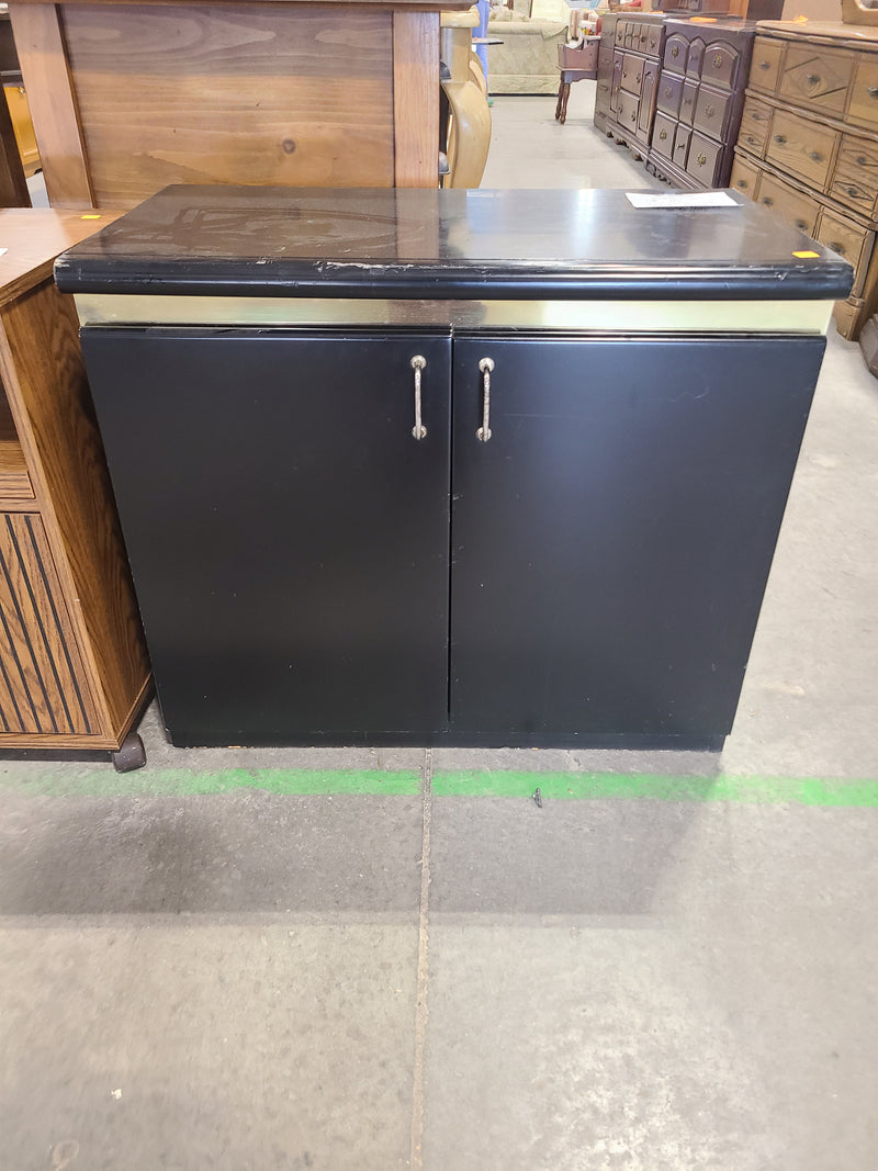 Small Black Two-Door Storage Cabinet with Metallic Trim
