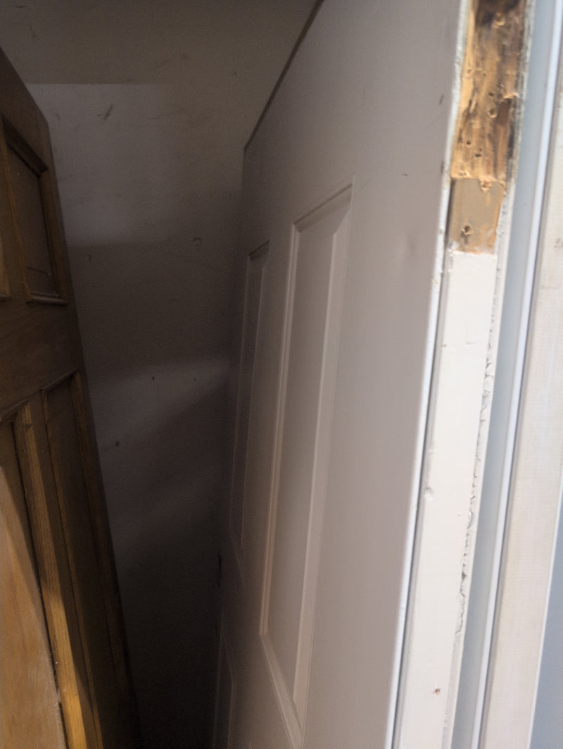White Exterior Door with Pre-Drilled Holes and a Door Knocker
