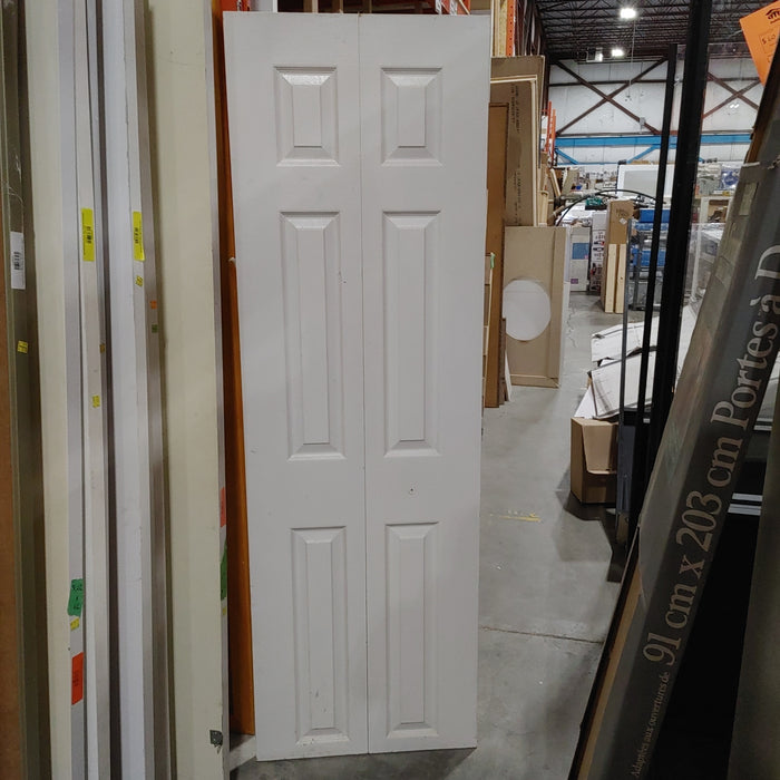 White bi fold door 23.5"W